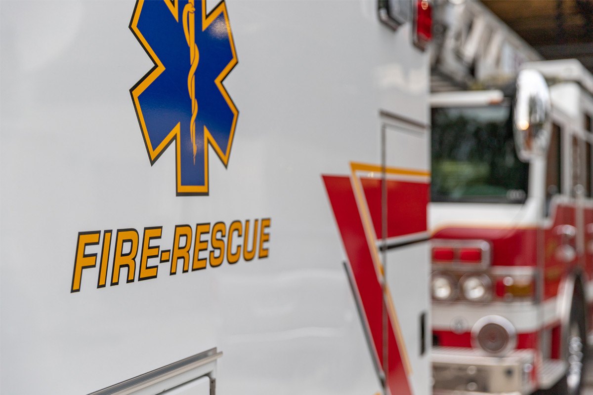 Close up of the words "Fire-rescue" on an ambulance.