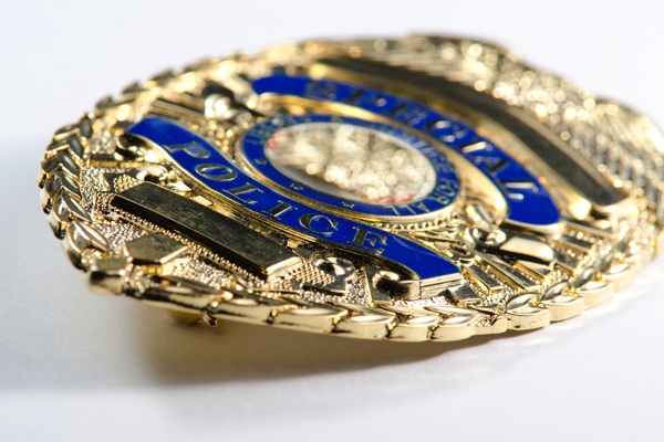 Close up of police badge laying on its side