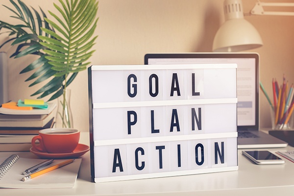 Tabletop marquee sign with the words goal, plan and action.