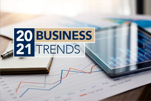 2021 business trends graphic featuring a tablet, notepad and pen
