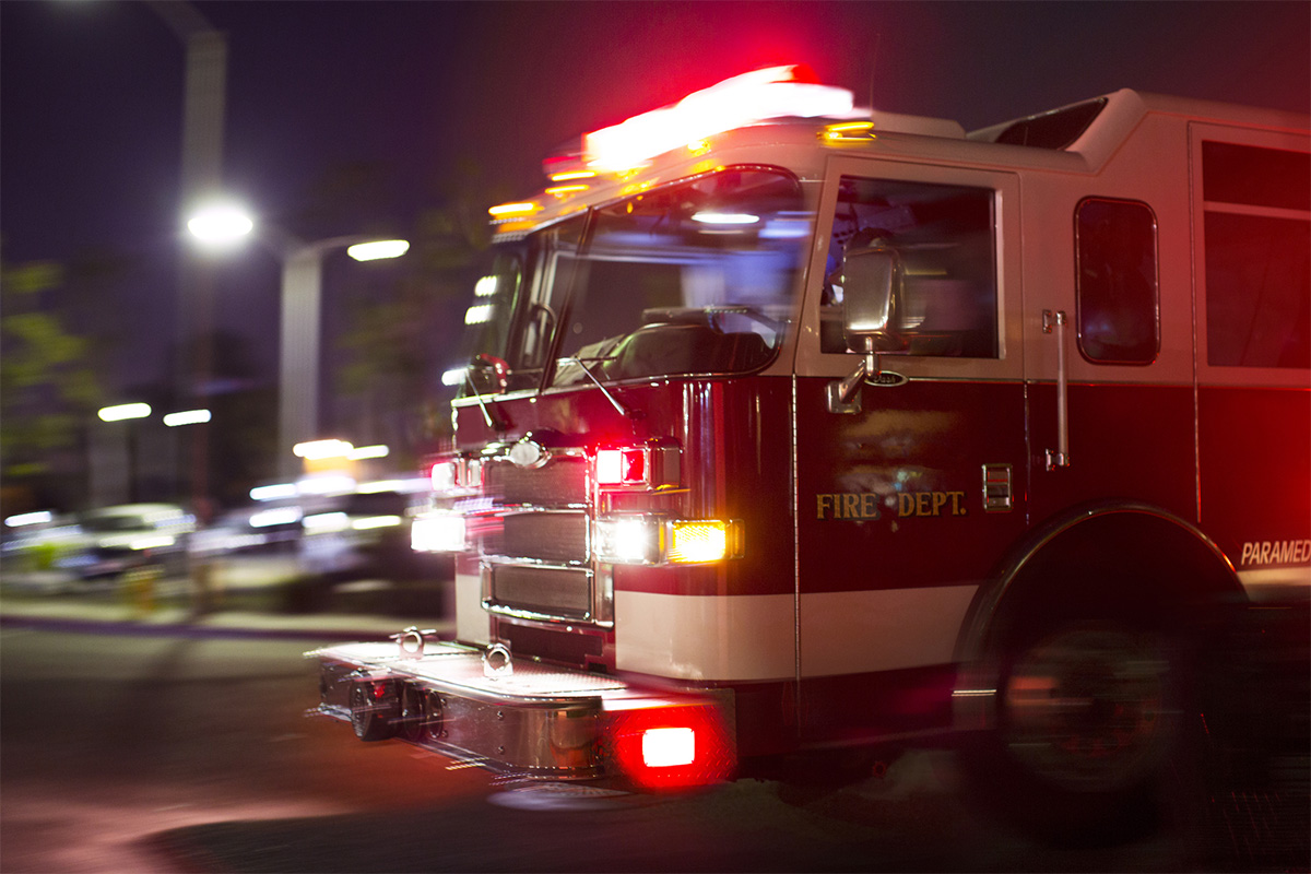 fire truck responding to an ems call at night