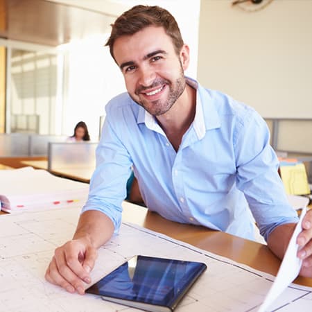 smiling man with tablet
