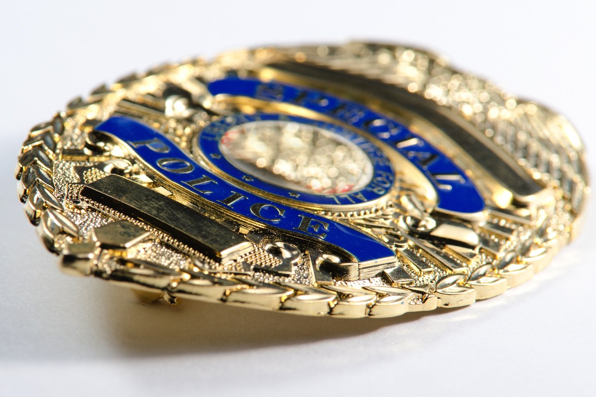 Close up of police badge laying on its side