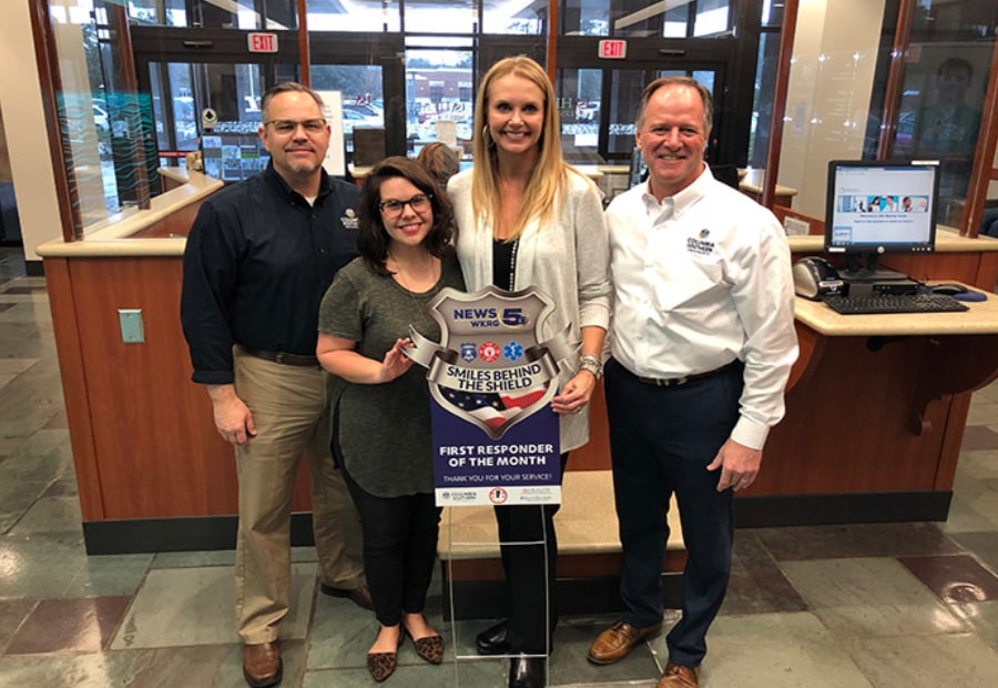 CSU employees with Smiles behind the Shield award