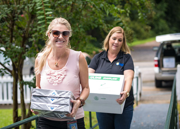 CSU Staff Members delivering boxes