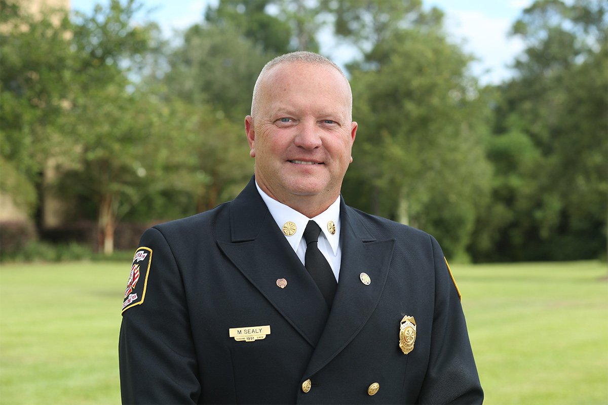 Fire Chief Mark Sealy smiles into the camera.