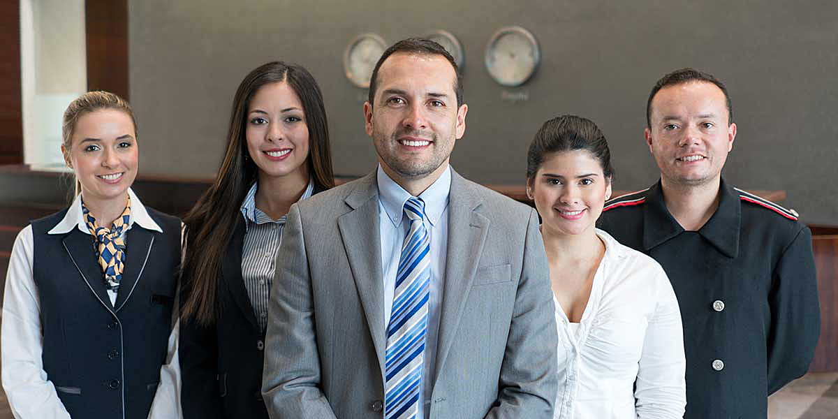 hospitality and tourism professionals posing for a group photo