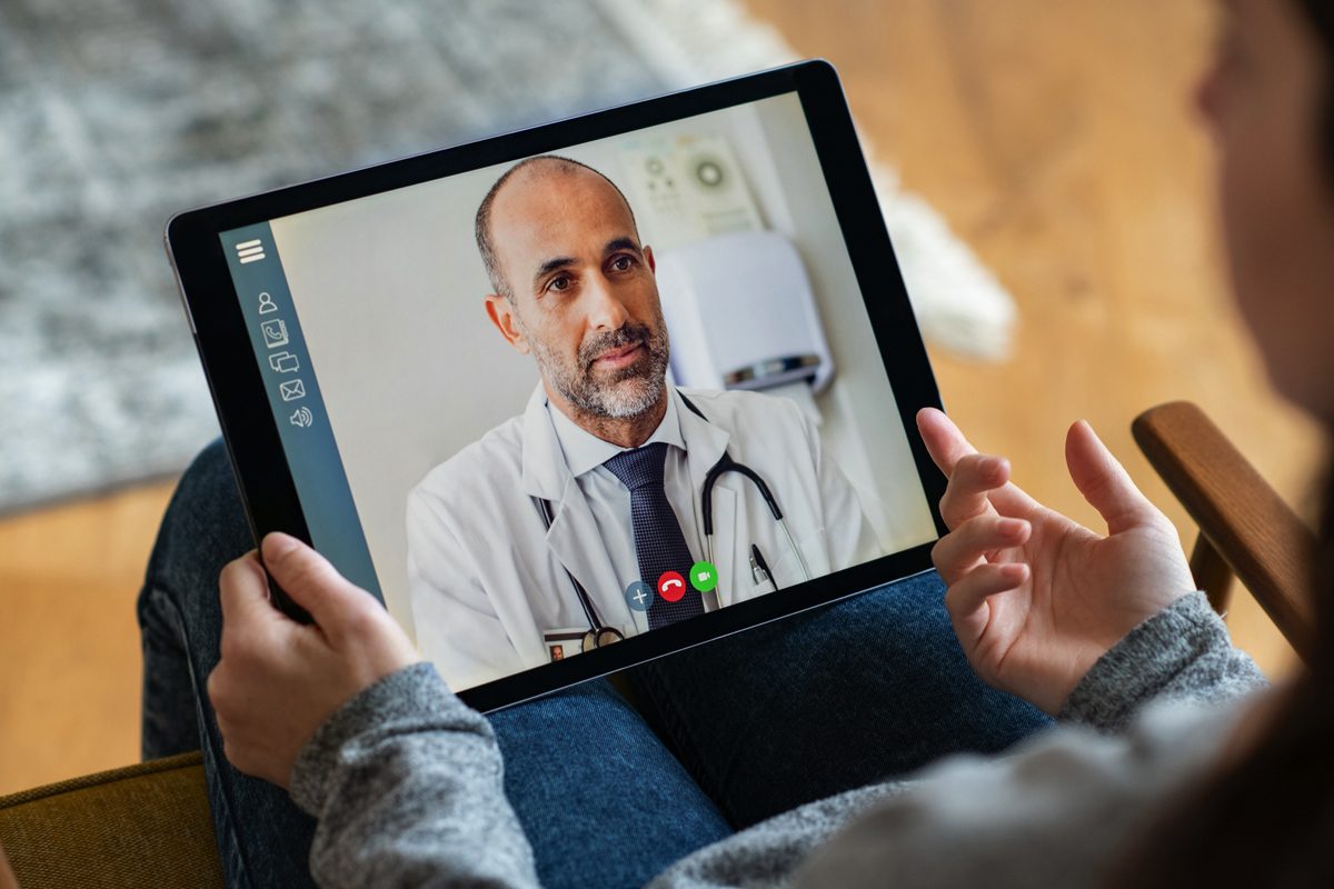 Video chat with a doctor through a tablet.