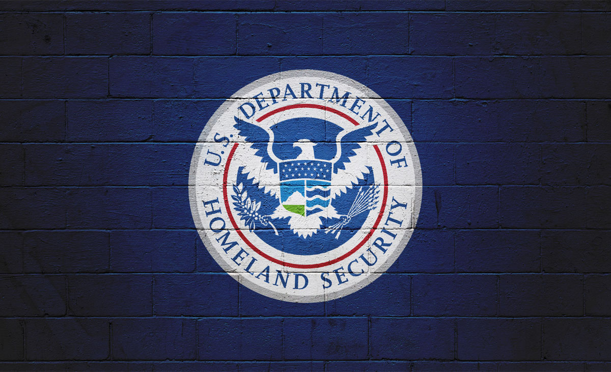 department of homeland security logo on a blue brick background