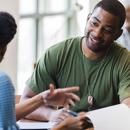 Veteran smiles during meeting