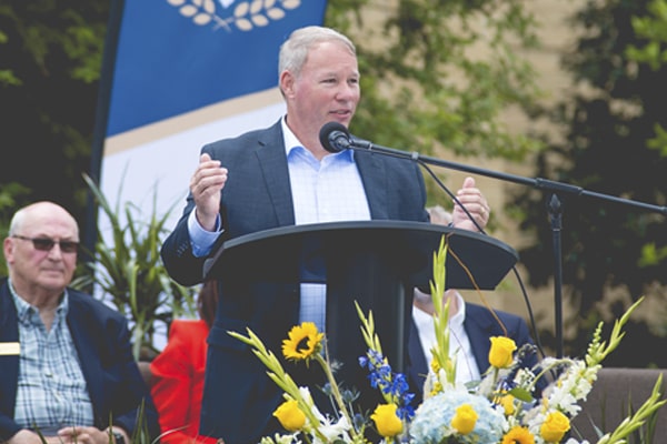 Chief of Staff Ken Styron at podium giving a speech