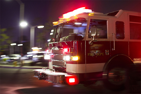 fire truck responding to an ems call at night