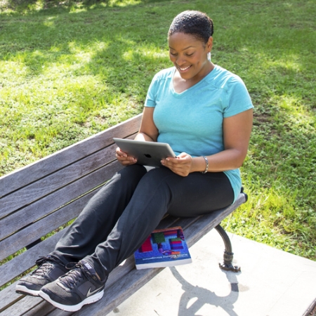 CSU student working on a tablet outside